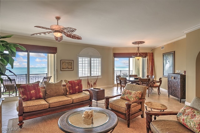 living room featuring light tile patterned floors, ornamental molding, a water view, and ceiling fan