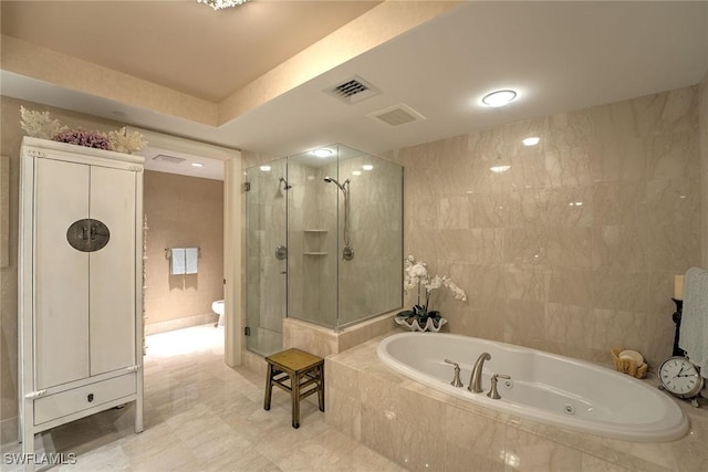 full bathroom with a stall shower, tile walls, visible vents, and a bath