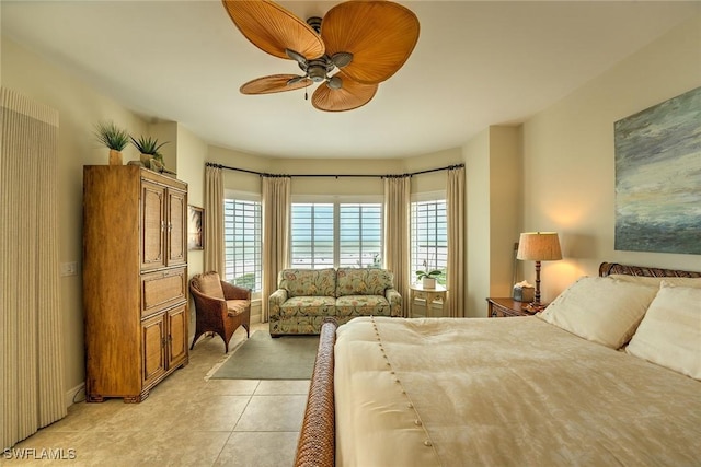 bedroom with light tile patterned floors and ceiling fan