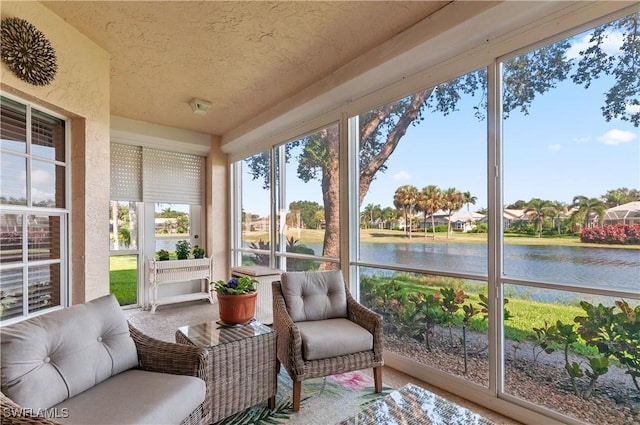 sunroom / solarium with a water view