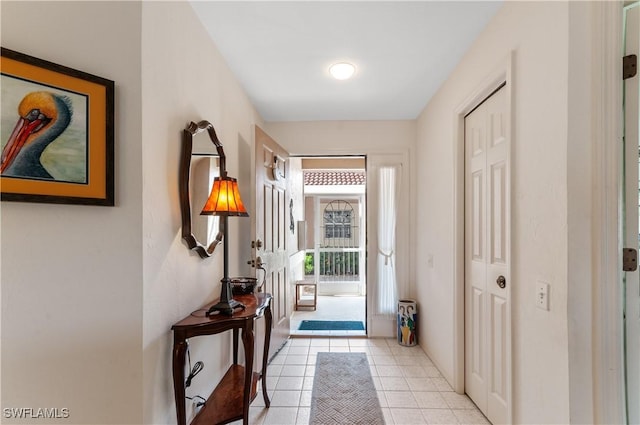 doorway featuring light tile patterned flooring