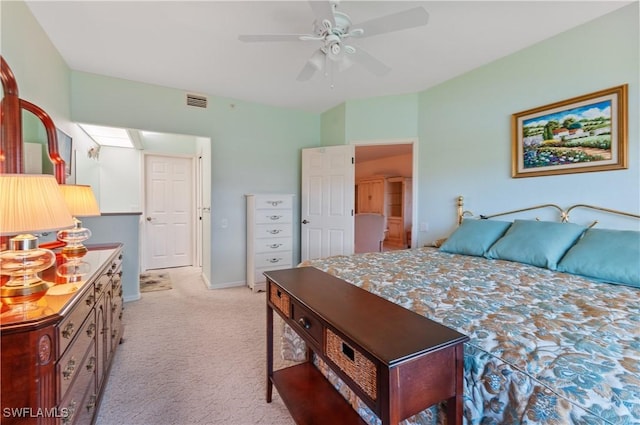 bedroom with baseboards, ceiling fan, visible vents, and light colored carpet