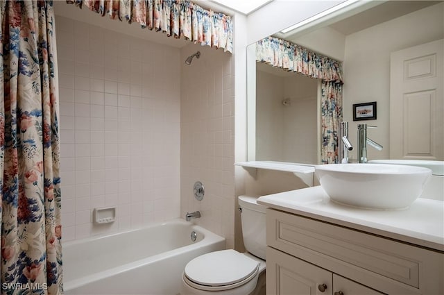 full bathroom with vanity, toilet, and shower / tub combo with curtain