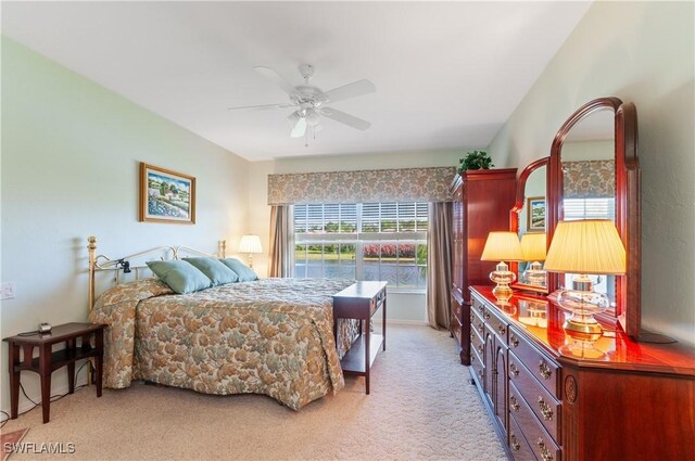 bedroom featuring ceiling fan and light colored carpet