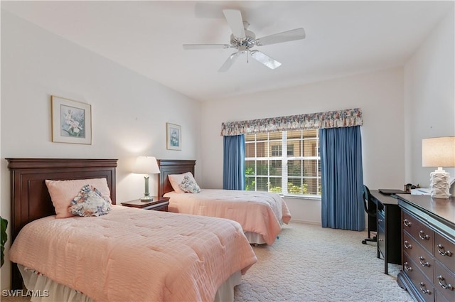 bedroom featuring a ceiling fan and light colored carpet