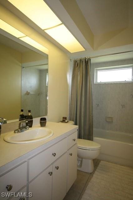 full bathroom featuring shower / tub combo, tile patterned flooring, vanity, and toilet