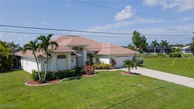 view of front of house featuring a garage and a front yard