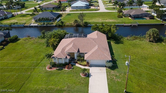 birds eye view of property with a water view and a residential view