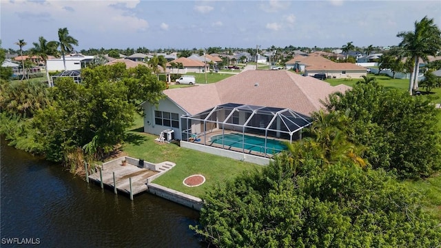 birds eye view of property featuring a water view and a residential view