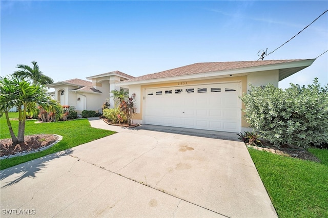 view of front of house with a garage, concrete driveway, a front lawn, and stucco siding