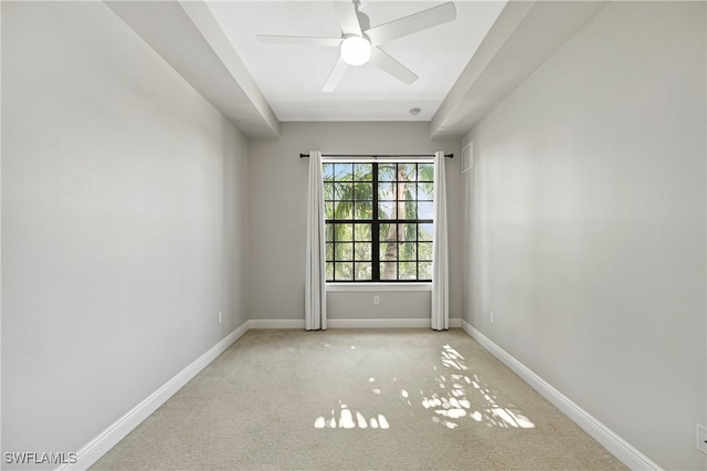 empty room featuring carpet and ceiling fan