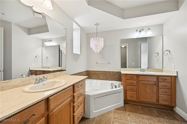 full bathroom with a bath, visible vents, two vanities, and a sink