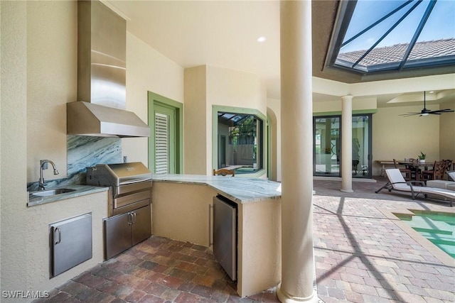 view of patio / terrace with ceiling fan, sink, a lanai, grilling area, and area for grilling