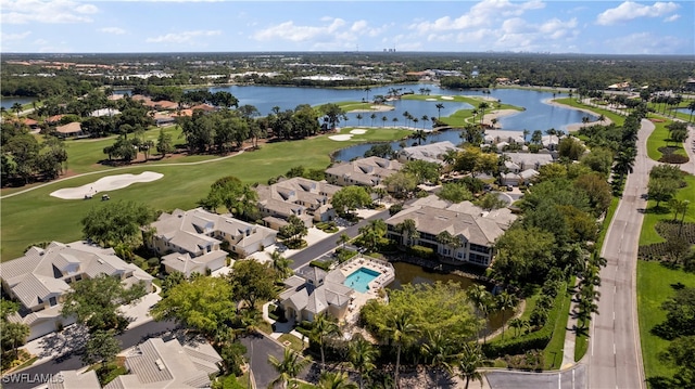 birds eye view of property with a water view