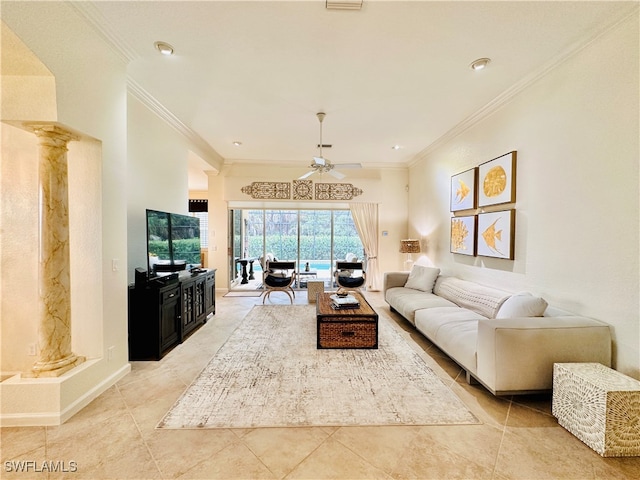 tiled living room featuring ornamental molding, decorative columns, and ceiling fan