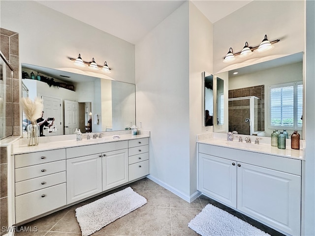 bathroom featuring vanity, tile patterned floors, and walk in shower