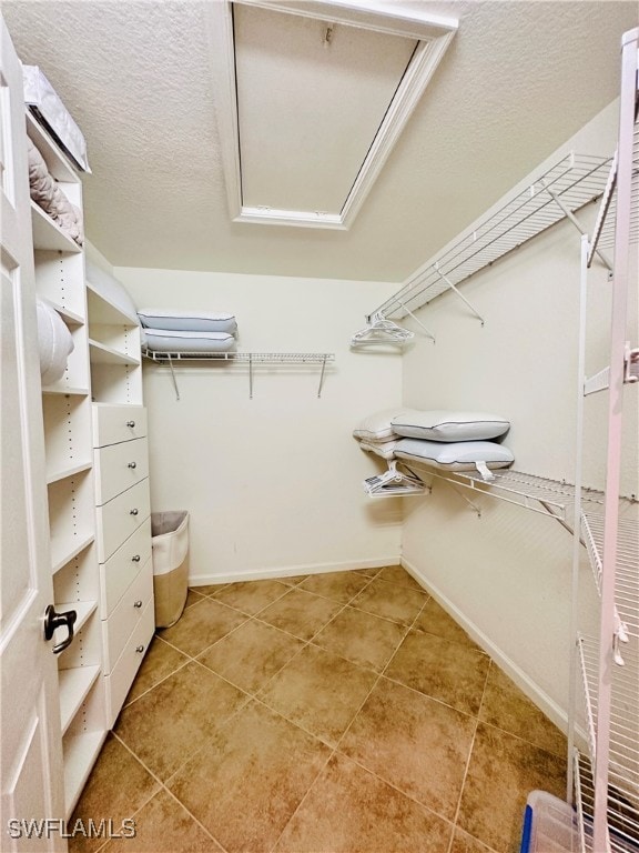 walk in closet featuring light tile patterned floors