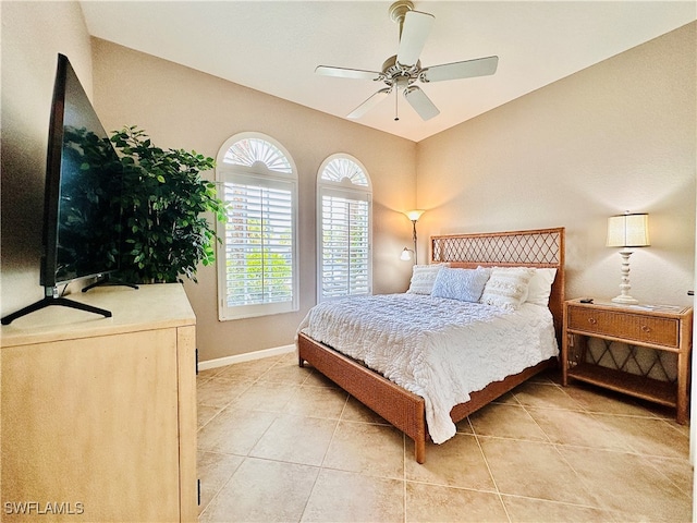 bedroom with light tile patterned flooring and ceiling fan