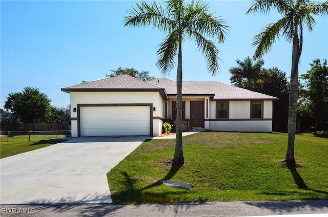 ranch-style house featuring a garage and a front yard