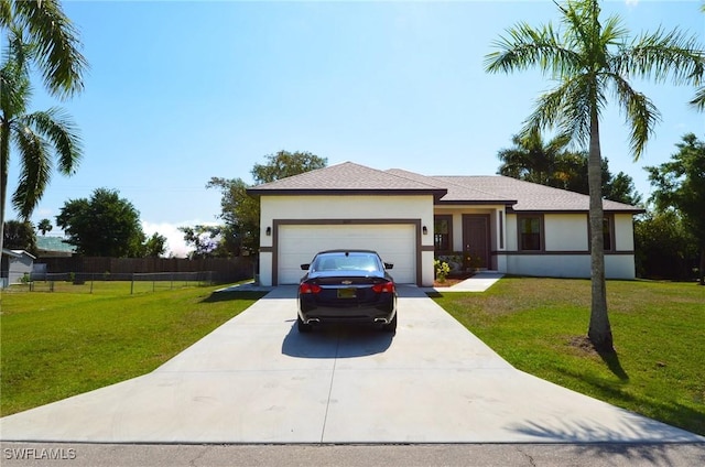 view of front facade featuring a garage and a front lawn