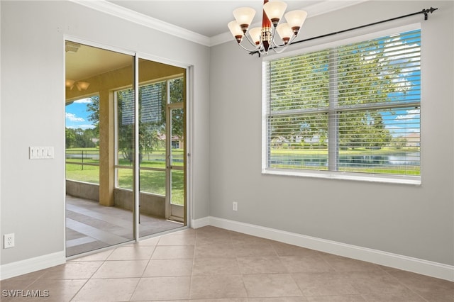 spare room with a wealth of natural light and light tile patterned floors