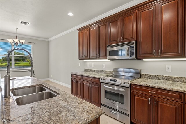 kitchen featuring crown molding, an inviting chandelier, appliances with stainless steel finishes, pendant lighting, and sink