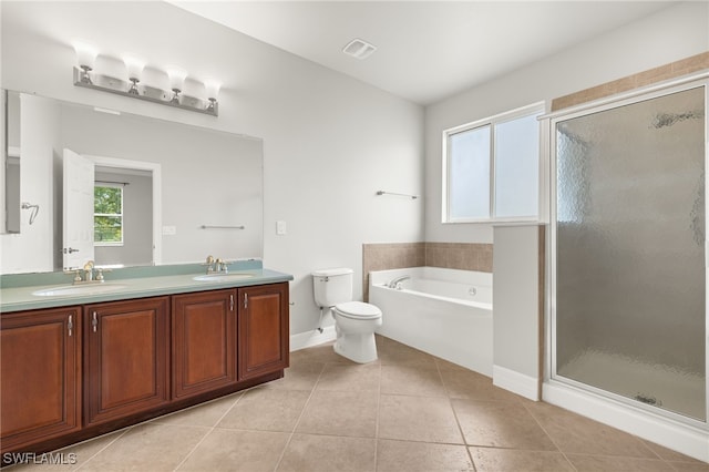 full bathroom with tile patterned floors, shower with separate bathtub, double sink vanity, and toilet