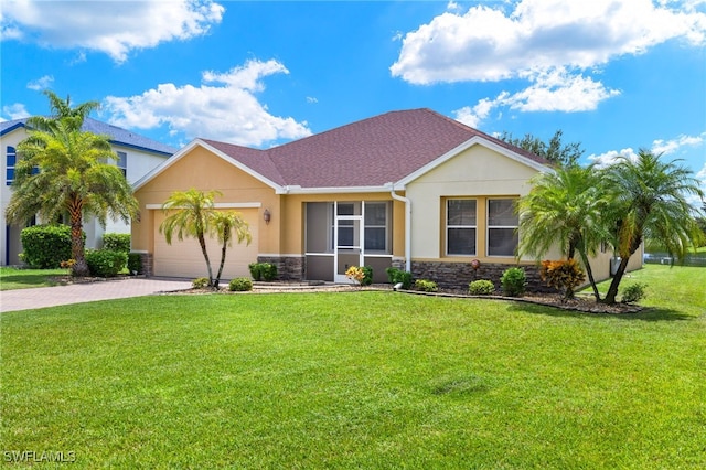 ranch-style home featuring a garage and a front lawn