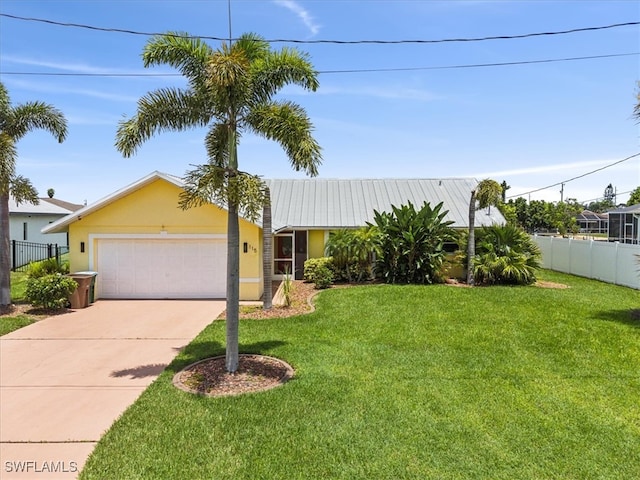 view of front of home featuring a garage and a front yard