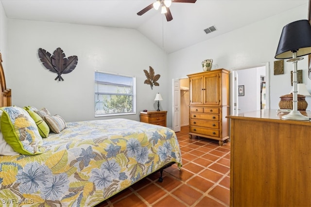 tiled bedroom featuring ceiling fan and vaulted ceiling