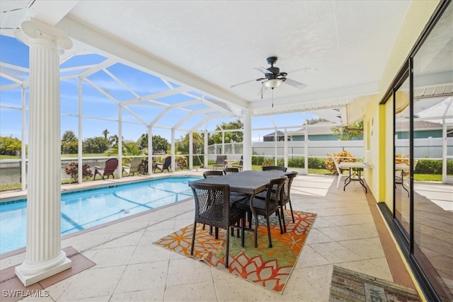 view of swimming pool with a lanai, a patio, and ceiling fan