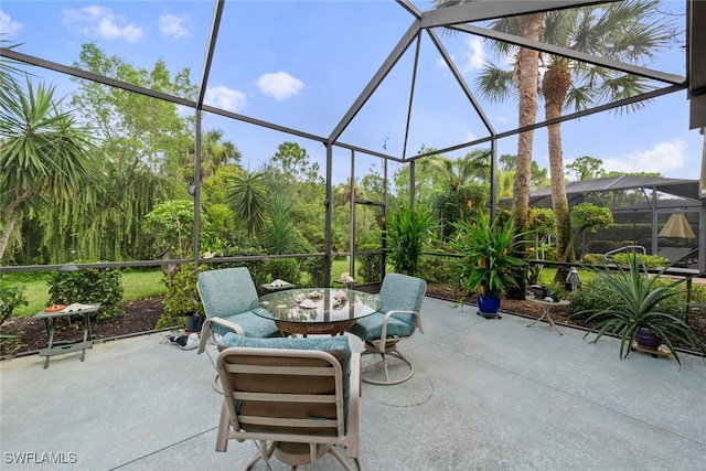 view of patio / terrace with glass enclosure