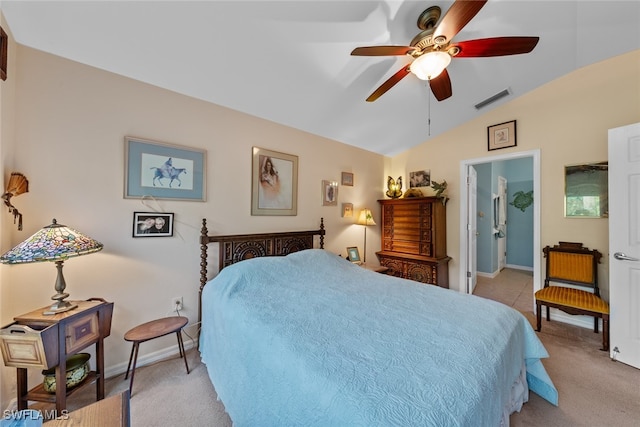 carpeted bedroom with ceiling fan and vaulted ceiling