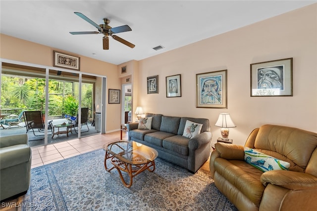 living room featuring ceiling fan and light tile patterned floors