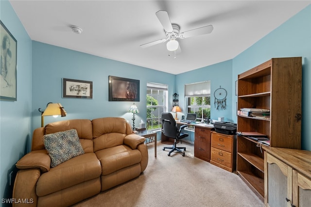 carpeted office with ceiling fan