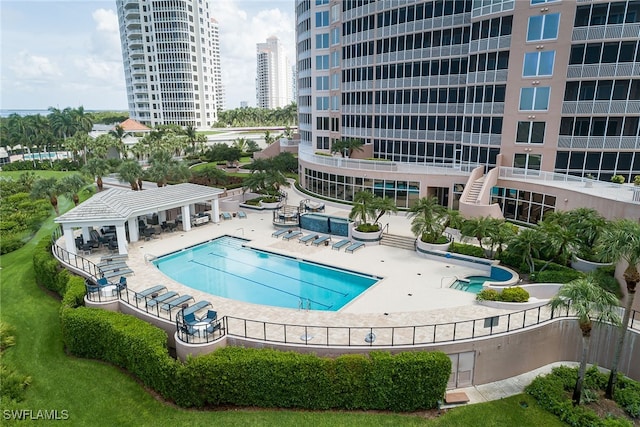 view of swimming pool with a patio