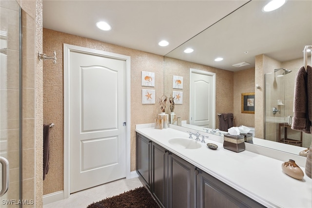 bathroom with vanity, tile patterned floors, and a shower with shower door