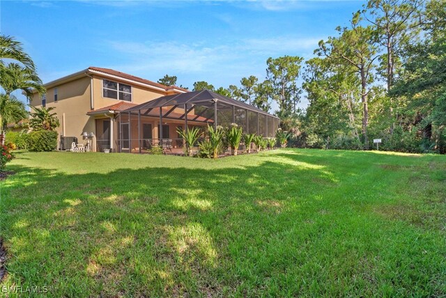 view of yard featuring a lanai