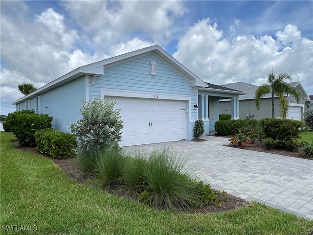 single story home featuring a garage