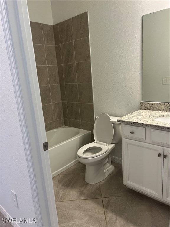 full bathroom featuring shower / bath combination, tile patterned floors, vanity, and toilet