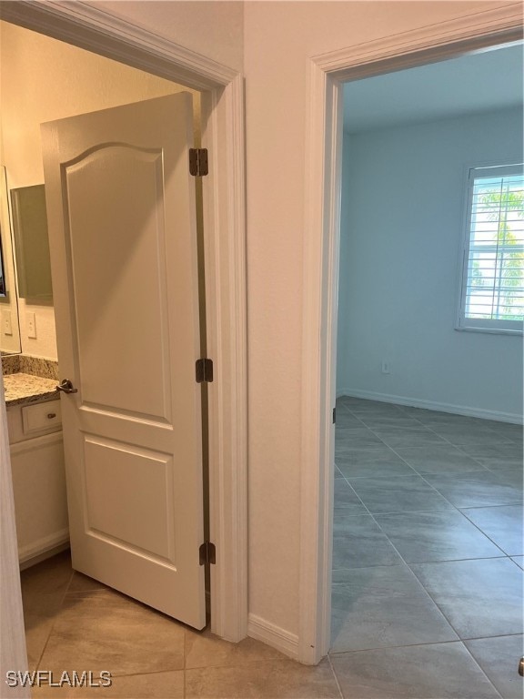 bathroom featuring tile patterned floors and vanity