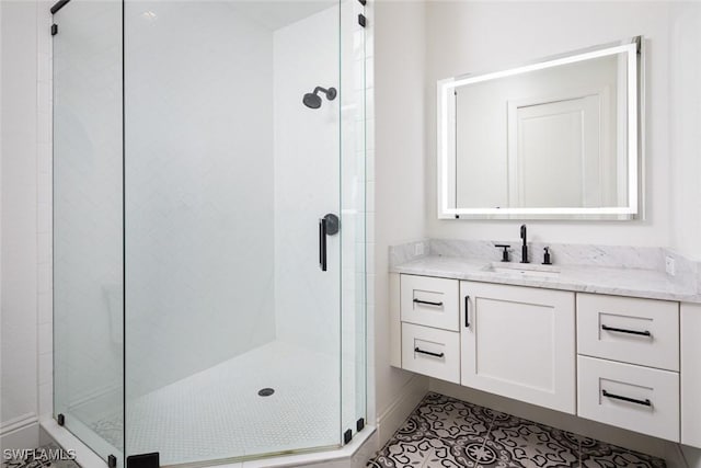 bathroom with vanity, tile patterned floors, and walk in shower