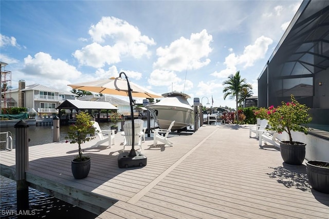 view of dock with a water view and a lanai