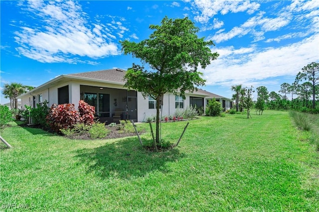 view of yard featuring a sunroom