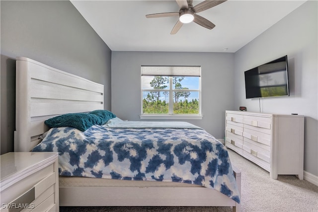 bedroom with light colored carpet and ceiling fan