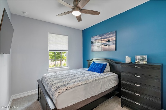 bedroom featuring light carpet and ceiling fan