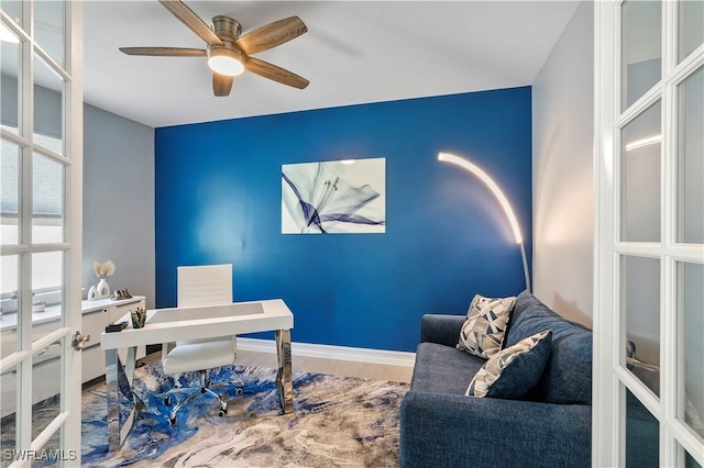 office space with a ceiling fan, french doors, baseboards, and wood finished floors