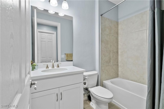 bathroom featuring vanity, toilet, and shower / bath combo with shower curtain