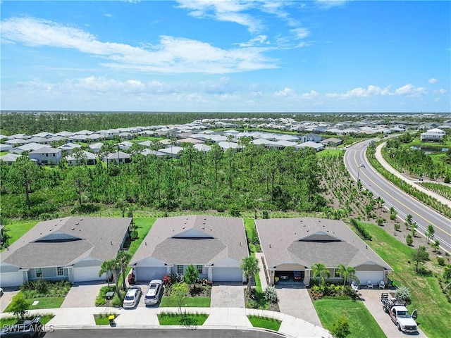 birds eye view of property with a residential view