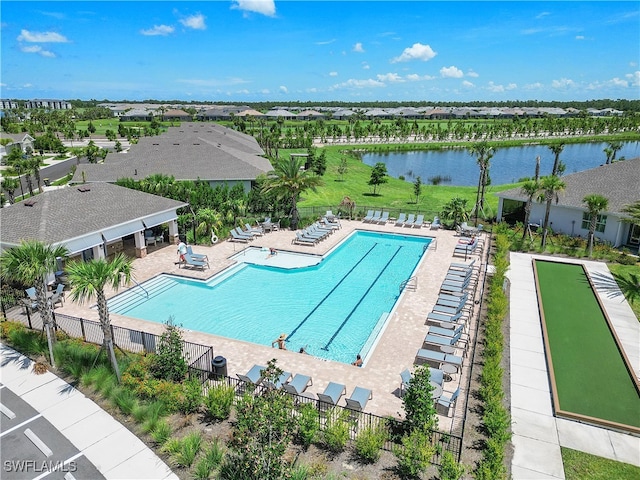 view of pool with a patio area and a water view